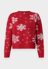 Pull rouge avec un col rond, orné de flocons de neige blancs et d'accents scintillants. Manches et ourlet côtelés, design cropped.