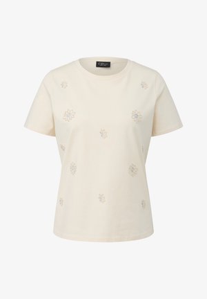 Cremefarbenes T-Shirt mit kurzen Ärmeln und Rundhalsausschnitt, verziert mit kleinen, bestickten Blumenmustern auf der Vorderseite.