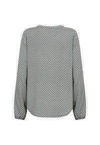 Blouse à manches longues avec un col rond. Présente un motif géométrique en noir et blanc. Tissu doux avec une coupe légèrement ample.