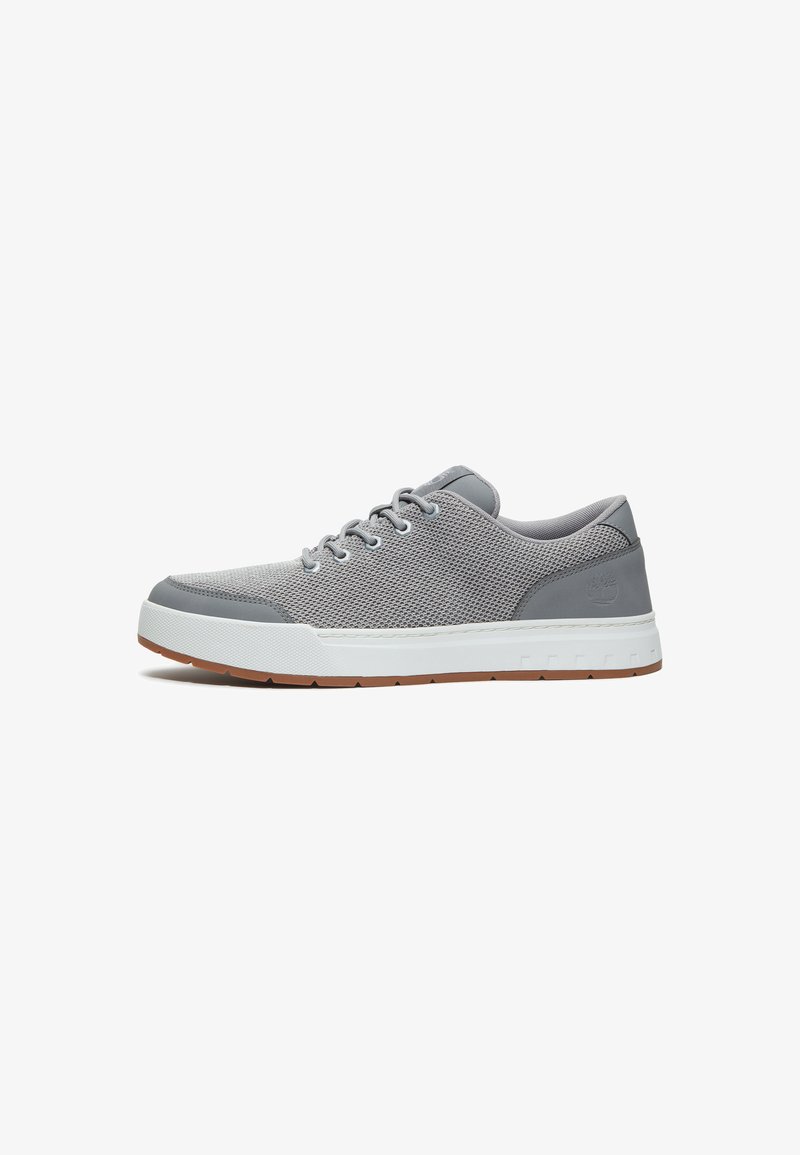 Gray mesh and leather sneakers with a white midsole and brown rubber outsole, featuring round laces and minimal branding on the heel.