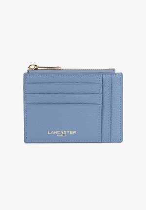Light blue leather card holder with four slots and a zippered compartment. Features gold lettering “LANCASTER PARIS” on the front.