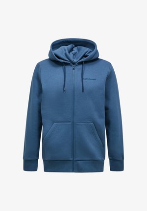 Kék zipzáras kapucnis pulóver puha anyagból. Húzózsinórral ellátott kapucnival, két elülső zsebbel és bordázott mandzsettákkal, valamint alsó részel. Diszkrét logó a mellkason.