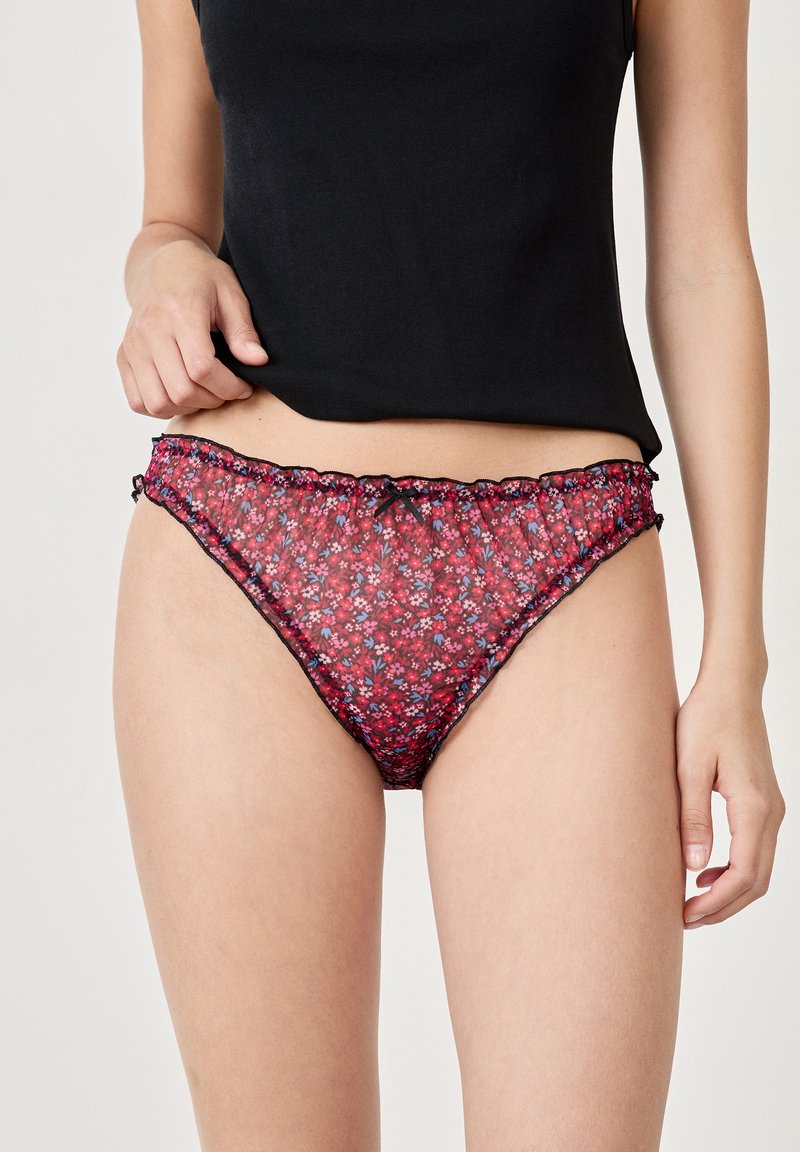 Floral print bikini briefs in red and blue on a sheer background, featuring black lace trim and a gathered waistband detail.