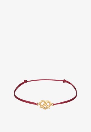 Justerbart armbånd med et charm i guldfarvet metal i uendelighedsnots design på en bordeaux farvet snor. Glat tekstur med enkle designelementer.
