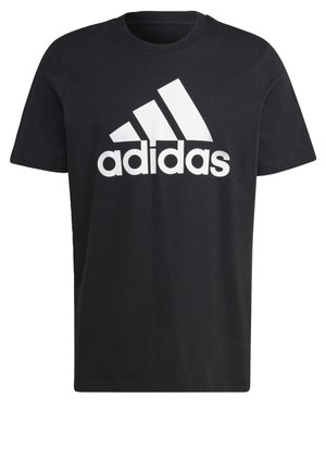 T-shirt en coton noir avec un grand logo Adidas blanc et trois bandes diagonales sur la poitrine. Manches courtes et coupe standard.