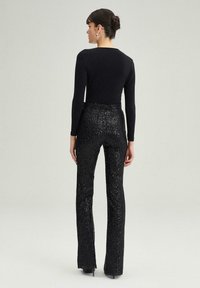 Touché Privé HIGH WAIST SEQUIN  - Nohavice - black