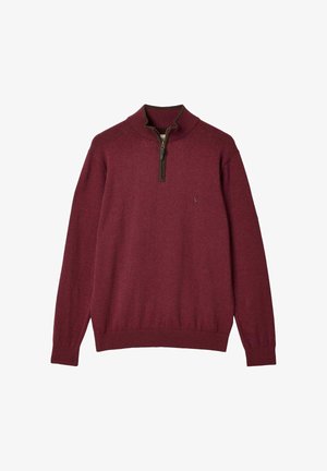 Maglione lungo a maniche con zip parziale frontale in color marsala, dotato di colletto, polsini e bordo ribattuti, realizzato in un morbido tessuto a maglia.