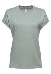 T-shirt uni vert clair à manches courtes avec col rond, ourlets des manches repliés et petite étiquette en tissu à l'intérieur du col.