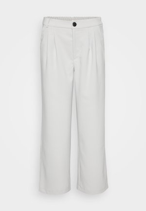 Valged, laiad püksid, mis on valmistatud siledast materjalist, pleeditud esitükiga ja elastse vöökoha ning nööbiga kinnitusega.