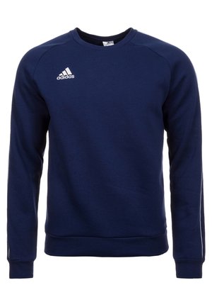 Granatowa bluza Adidas z okrągłym dekoltem i długimi rękawami, z białym logo Adidas na górnej lewej części klatki piersiowej.