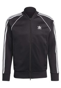 Black zip-up jacket with white three-stripe design on sleeves, ribbed cuffs, and collar. Features an Adidas logo on the left chest.