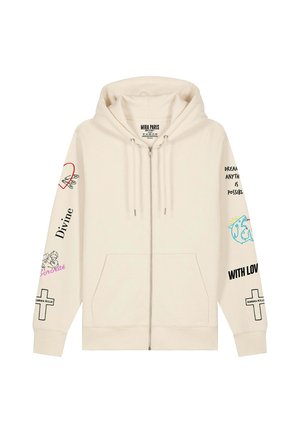 Felpa con cappuccio e zip color crema con tasca frontale, caratterizzata da stampe grafiche colorate sulle maniche, inclusi testi e illustrazioni.