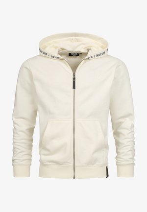 Crème kleurige zip-up hoodie van zachte stof. Voorzien van een trekkoord kap met bedrukte logo, voorzakken en geribbelde manchetten. Subtiele branding op de borst.