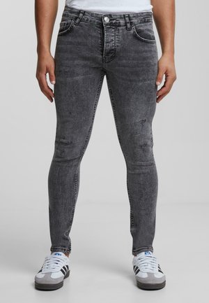 Grijze denim jeans met een slim fit, lichte versleten details, een klassieke vijf-pocket stijl en een ritsopening.