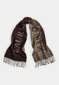 Ullskjerf med brunt og beige rutemønster, med frynsete kanter og dristig, gjentakende tekst i kontrasterende farger.