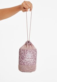 Drawstring bag in a light pink color, featuring a textured bottom, abstract patterns, and a prominent white logo. Ideal for lightweight storage.