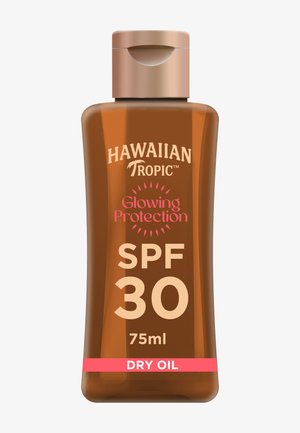 Flaske med Hawaiian Tropic Glowing Protection SPF 30 tør olie solcreme, 75 ml med beige flip-top låg.