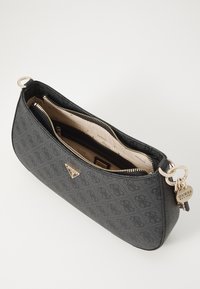 Black synthetic handbag with embossed logo pattern, gold-tone hardware, and a zip closure. Interior shows beige lining and multiple compartments.