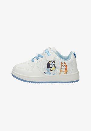 White and blue kid’s sneaker with Velcro strap, light blue laces, and cartoon dog characters on the side panel.