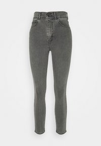 Jean skinny gris taille haute avec fermeture à boutons et zip à l'avant, poches avant et arrière, et jambes fuselées longueur cheville.
