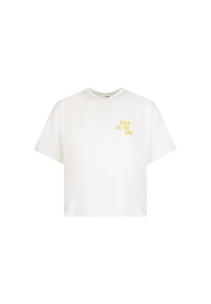 White cropped t-shirt with short sleeves and yellow text "SOUP OF THE DAY" on the left chest.