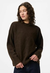 Brown knitted sweater with a round neck, ribbed cuffs, and hem. Features a relaxed fit and textured fabric for warmth.
