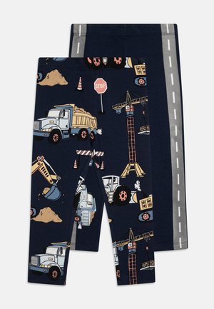 Cotton blend leggings featuring a navy background with construction-themed patterns, including trucks, cranes, and traffic signs, with reflective accents.