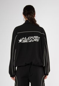 Love Scars COACH TRACK UNISEX - Treniņjaka - midnight purple