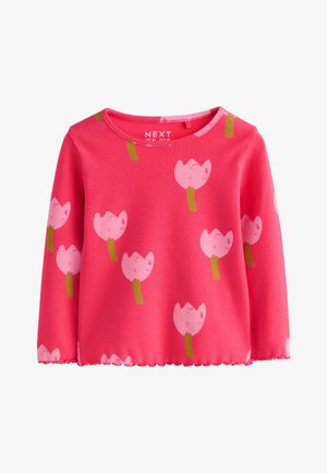 Chemise rose vif à manches longues pour tout-petit avec un ourlet festonné, présentant un motif de simples tulipes roses aux tiges vertes.