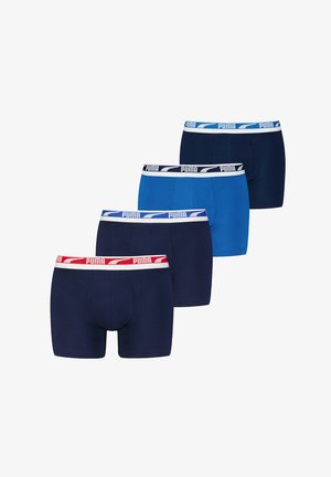 Four pairs of boxer shorts in varying shades of blue. Each features a contrasting elastic waistband with the Puma logo.