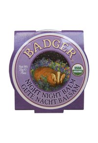 Badger Night Night Balm, rund lila behållare, med en illustration av en grävling omgiven av blommor, märkt som USDA Organic. 21g.