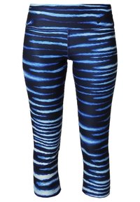 Legginsy w niebiesko-białe wzory, charakteryzujące się dopasowanym krojem, wykonane z gładkiego, elastycznego materiału z talią średniego wzrostu.