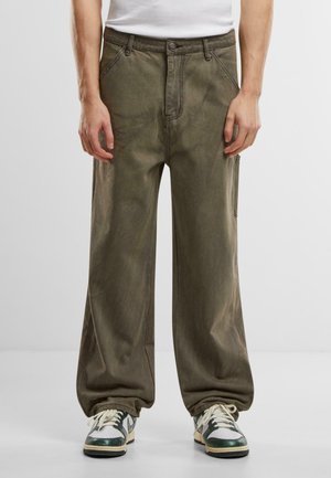 Wide-leg olive green pants made from a textured fabric, featuring front pockets, a metal button closure, and subtle fading details.