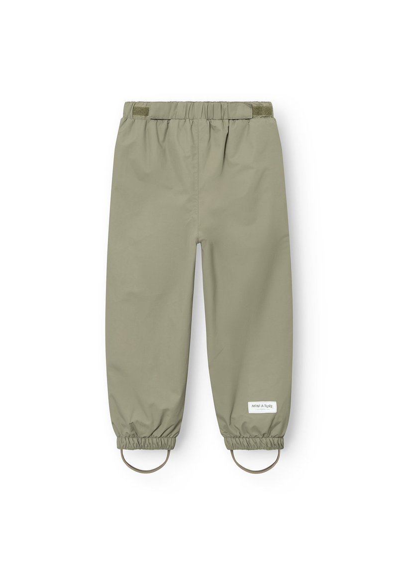 Light olive green waterproof pants with elastic waistband, adjustable cuffs, and circular hardware accents at the ankles. Smooth texture.