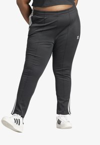 adidas Originals - ADICOLOR SUPERSTAR PLUS SIZE - Tracksuit bottoms - black Thumbnail Image 1