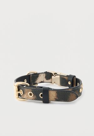Leather dog collar featuring a black and gold color scheme, with metal hardware, a textured pattern, and adjustable sizing holes.