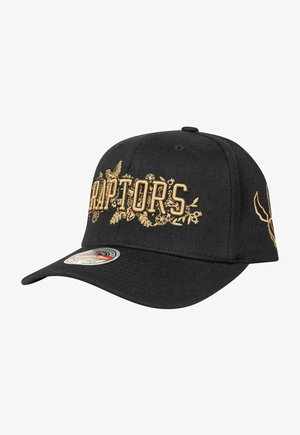 Black baseball cap with gold embroidered "Raptors" text and floral accents; features a curved brim and adjustable strap at the back.