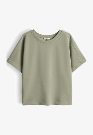 Lichtgroen katoenen T-shirt met korte mouwen, ronde hals en zichtbare stikseldetails, plat neerligt op een witte achtergrond.