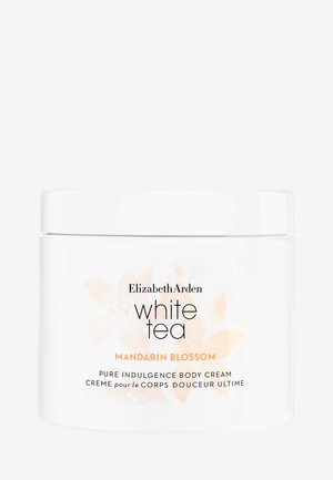 Vit burk med Elizabeth Arden White Tea Mandarin Blossom kroppskräm. Har en mjuk, vit konsistens med en blomsterdesign och svarta bokstäver.