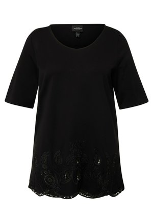 Schwarze kurzärmlige Tunika mit V-Ausschnitt, verziert mit dekorativer schwarzer Stickerei und einem gewellten Saum am unteren Rand. Weicher Stoff.