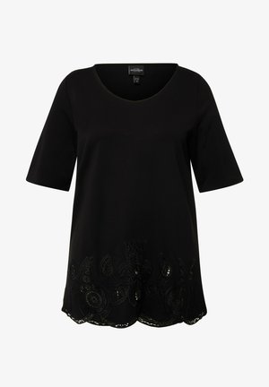 Schwarze kurzärmlige Tunika mit V-Ausschnitt, verziert mit dekorativer schwarzer Stickerei und einem gewellten Saum am unteren Rand. Weicher Stoff.