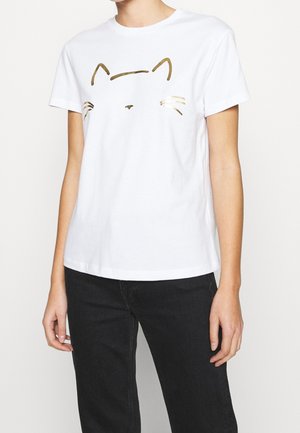 Biały bawełniany T-shirt z nadrukiem w postaci złotej twarzy kota, z prostymi liniami tworzącymi uszy i wąsy, okrągłym dekoltem oraz krótkimi rękawami.