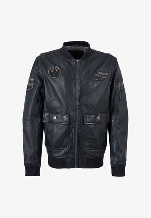 Schwarze Leder-Bomberjacke mit Reißverschluss, gerippten Bündchen und zwei Fronttaschen. Verziert mit mehreren gestickten Patches auf Brust und Ärmeln.