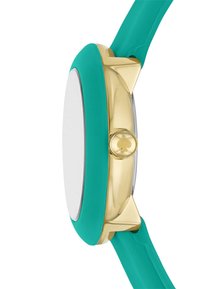 Teal silikonarmband med ett guldfärgat metallfodral, rund urtavla och en liten graverad spadetailj på kronan. Slät textur och stilren design.