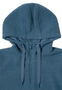 Veste en polaire bleu foncé avec une surface texturée, fermeture éclair à l'avant et capuche. Présente des cordons de serrage contrastés avec le texte "FAITES VOTRE PROPRE CHEMIN."