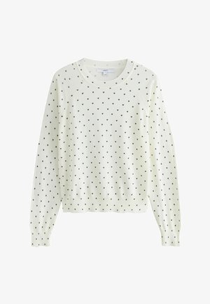 Balta megzta palaidinė su mažų juodų širdelių raštu, apvali apykaklė, briaunoti rankogaliai ir apačia, pagaminta iš minkštos medžiagos su tekstūruotu paviršiumi.