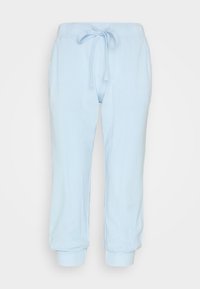 Lichtblauwe, lichte joggers van een katoenmix met een trekkoord in de taille en ribben aan de pijpen. Voorzien van zijzakken en een relaxte pasvorm.