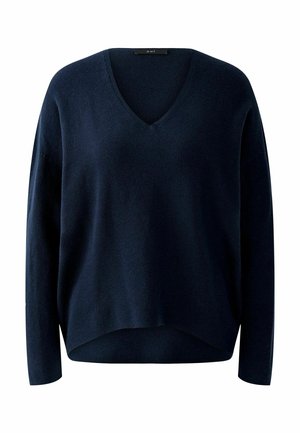 Pull en maille bleu marine avec un décolleté en V, des manches longues et une coupe décontractée. Dispose d'un ourlet légèrement court avec une texture côtelée.