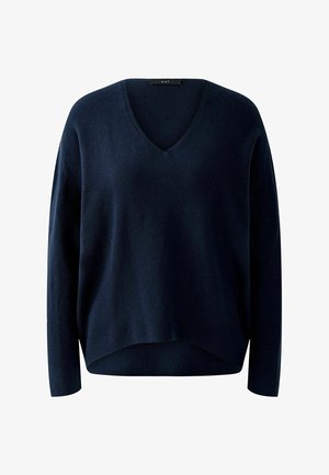 Pull en maille bleu marine avec un décolleté en V, des manches longues et une coupe décontractée. Dispose d'un ourlet légèrement court avec une texture côtelée.