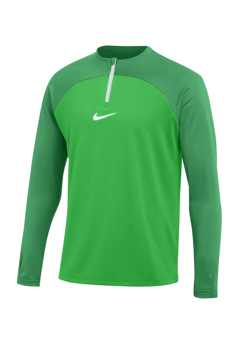 Haut de sport à manches longues vert avec un col zippé. Fabriqué en tissu lisse et léger. Présente un logo Nike blanc sur la poitrine.